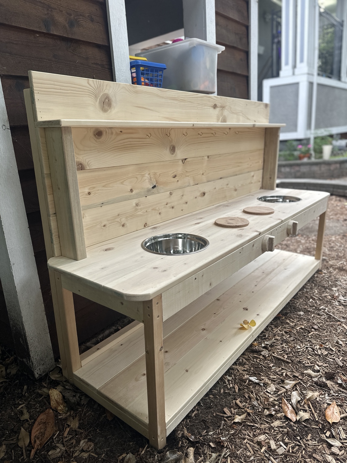 Six-foot natural wood mud kitchen delivered to a Montessori preschool