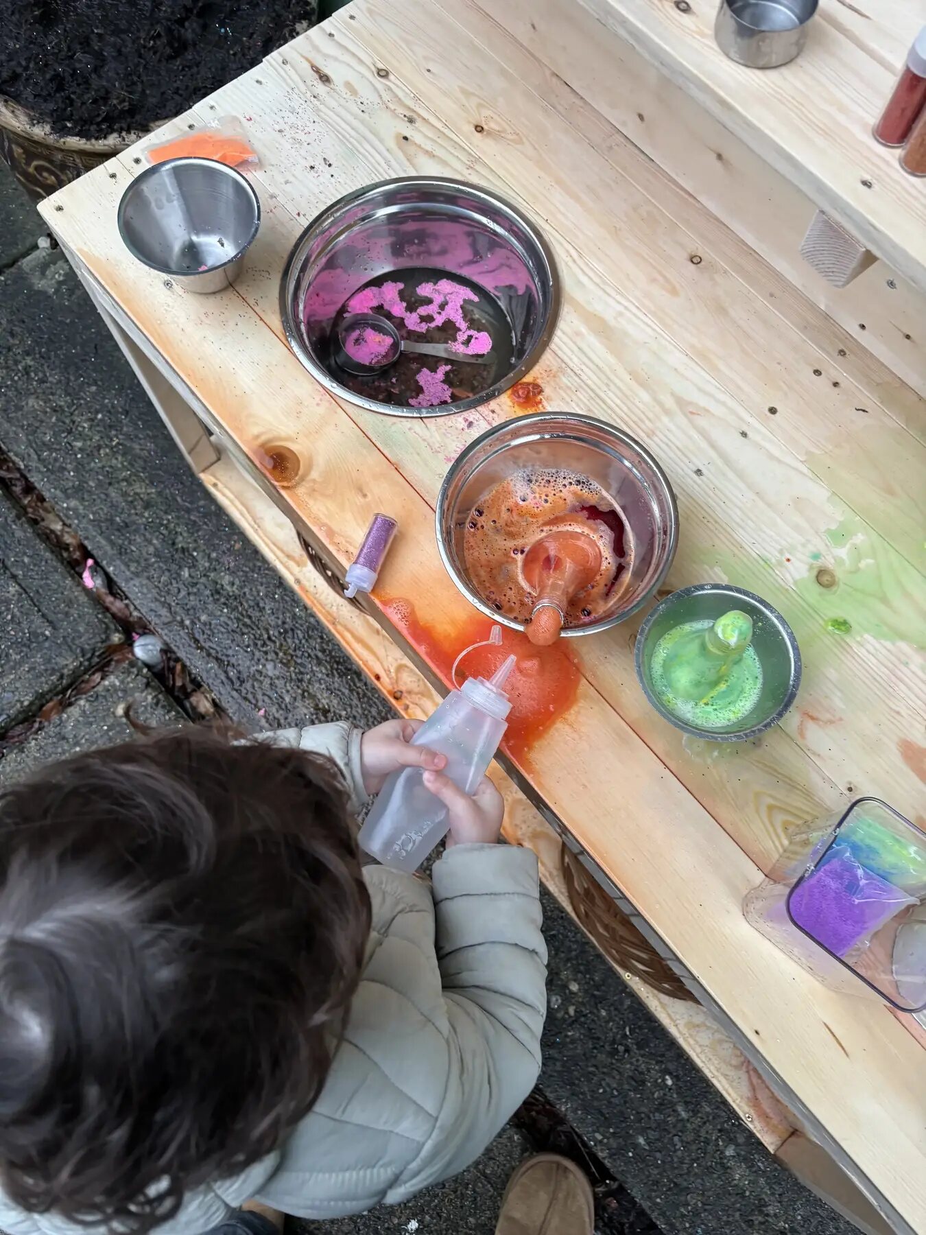 Child enjoying colourful sensory play